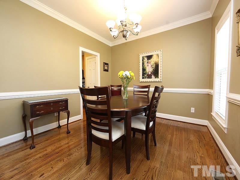 2008 Waterbrook Court Raleigh, NC 27603 - Photo 2 of 13 a view of a dining room with furniture and wooden floor