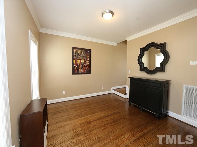 2008 Waterbrook Court Raleigh, NC 27603 - Photo 3 of 13 a view of an empty room with wooden floor and a window