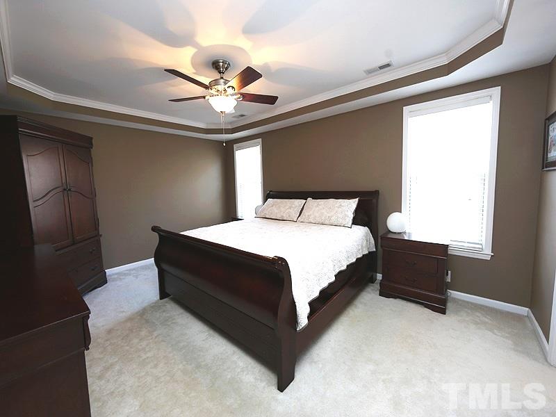 2008 Waterbrook Court Raleigh, NC 27603 - Photo 8 of 13 a bedroom with a bed and window