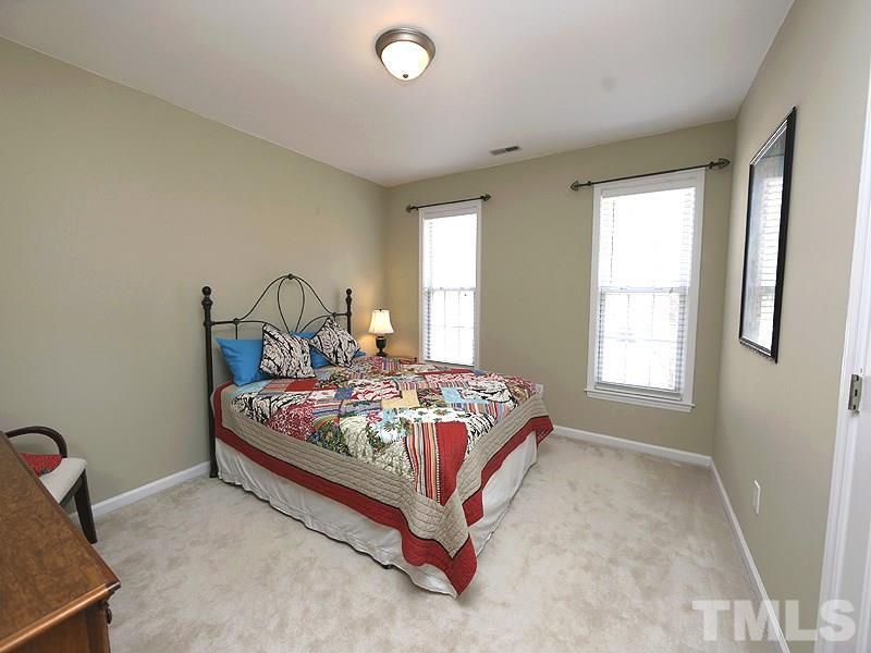 2008 Waterbrook Court Raleigh, NC 27603 - Photo 10 of 13 a bedroom with a bed and window