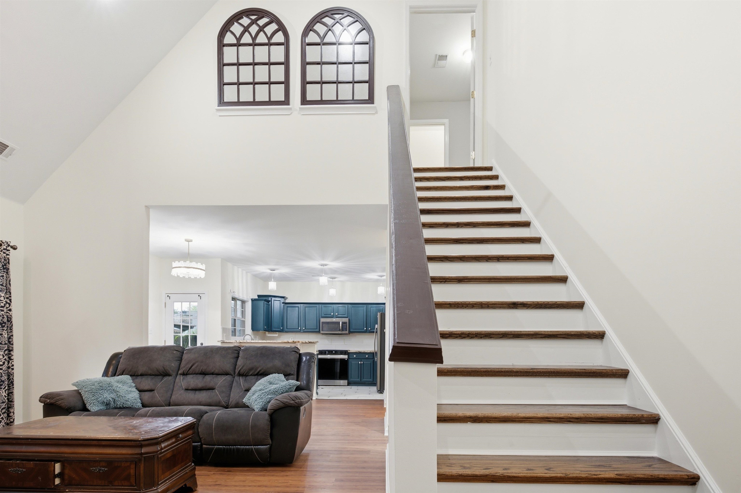 96 Berryfield Cove Collierville, TN 38017 - Photo 22 of 39 Two-story entry featuring an open staircase with wood-finish treads and a dark wood handrail