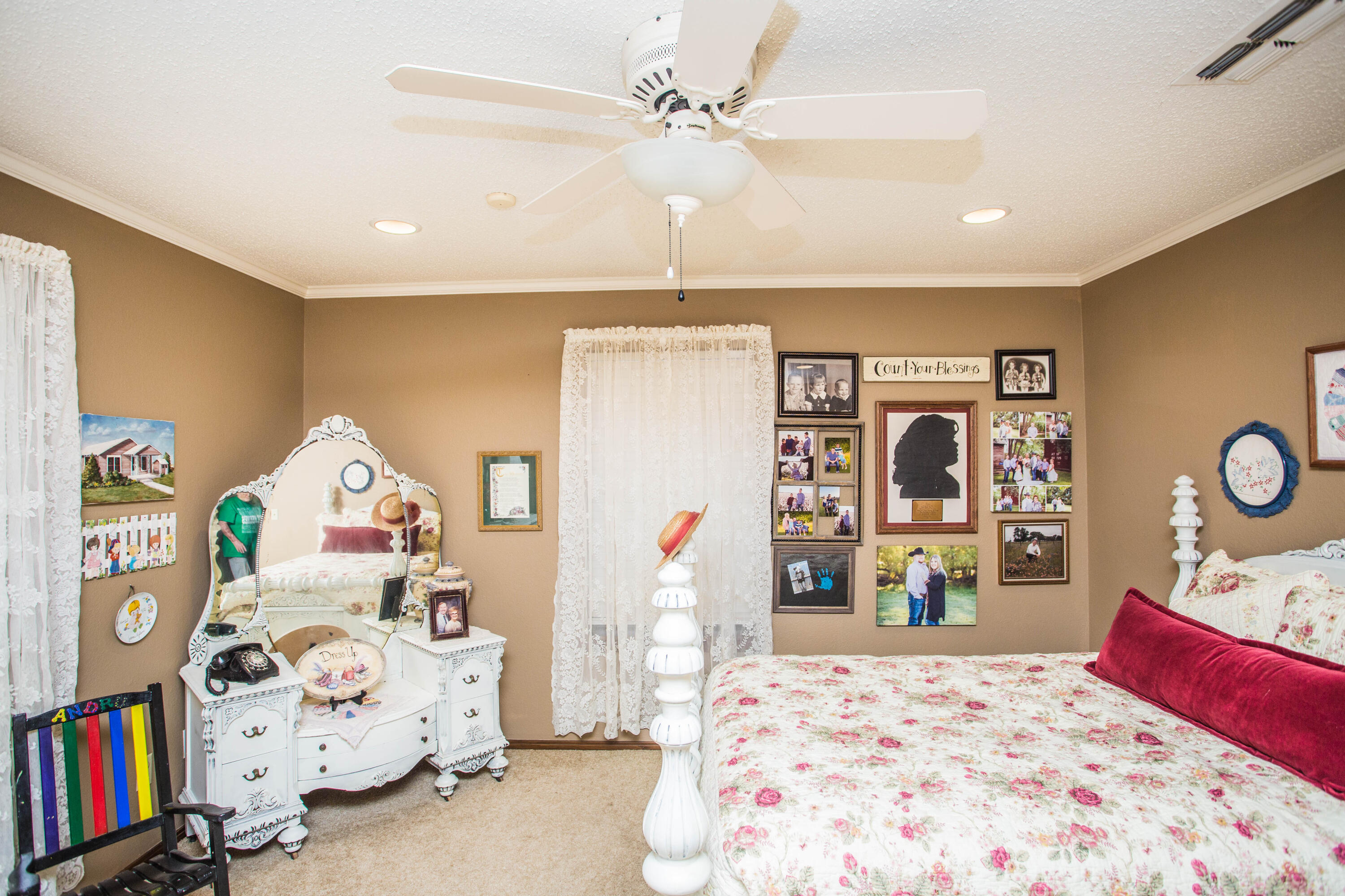 1304 Jefferson Drive Plainview, TX 79072 - Photo 25 of 50 a bedroom with a bed and dresser with mirror
