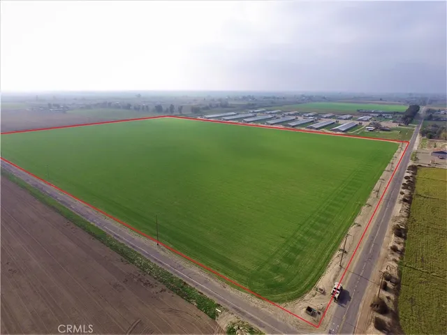 a view of a field with an ocean