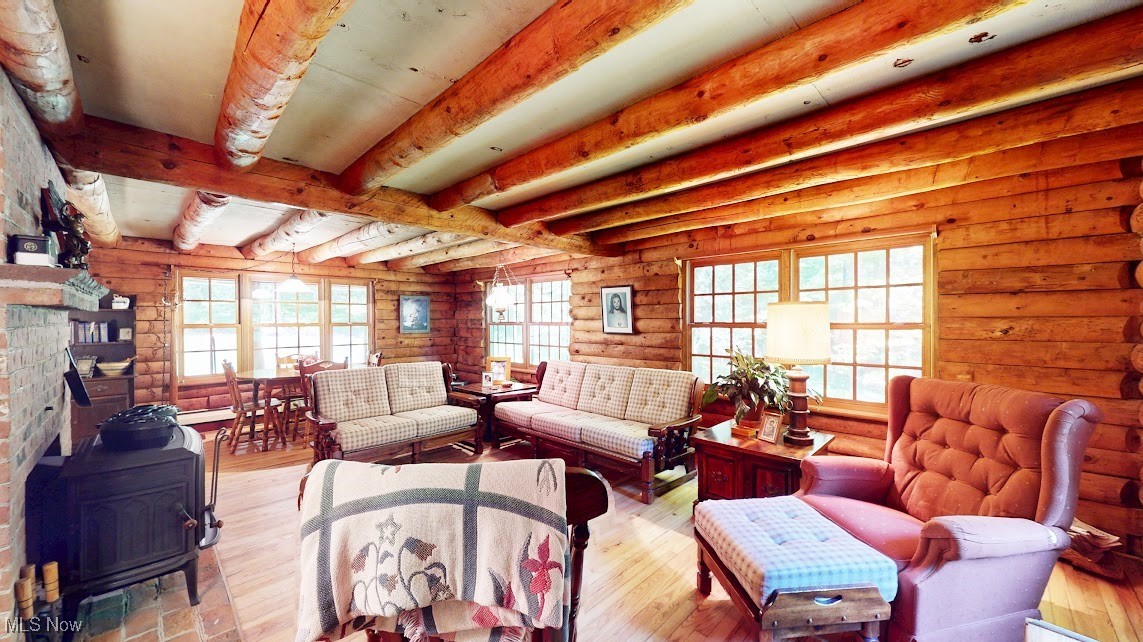9471 Sherman Road Chesterland, OH 44026 - Photo 10 of 40 Living room featuring a wood stove