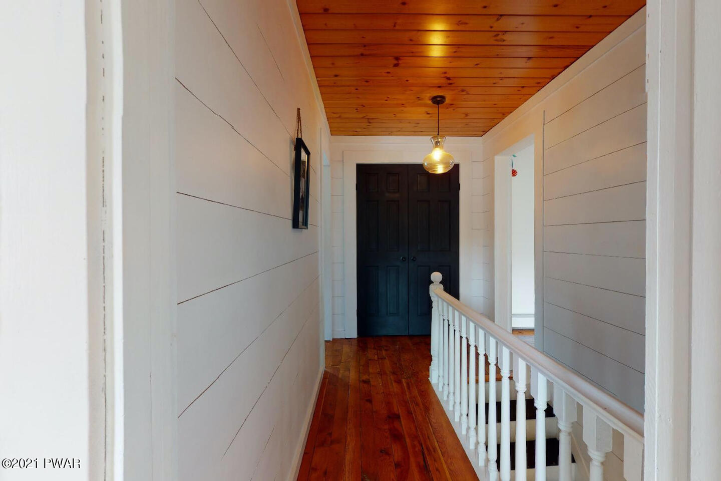 20 Pond Road Moscow, PA 18444 - Photo 50 of 59 a view of a hallway with wooden floor and staircase