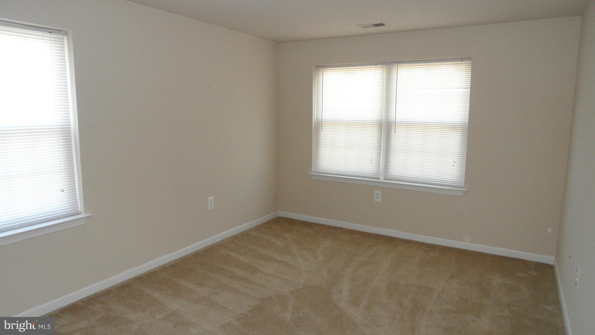18318 Streamside Drive, Unit 304 Gaithersburg, MD 20879 - Photo 11 of 30 an empty room with a window