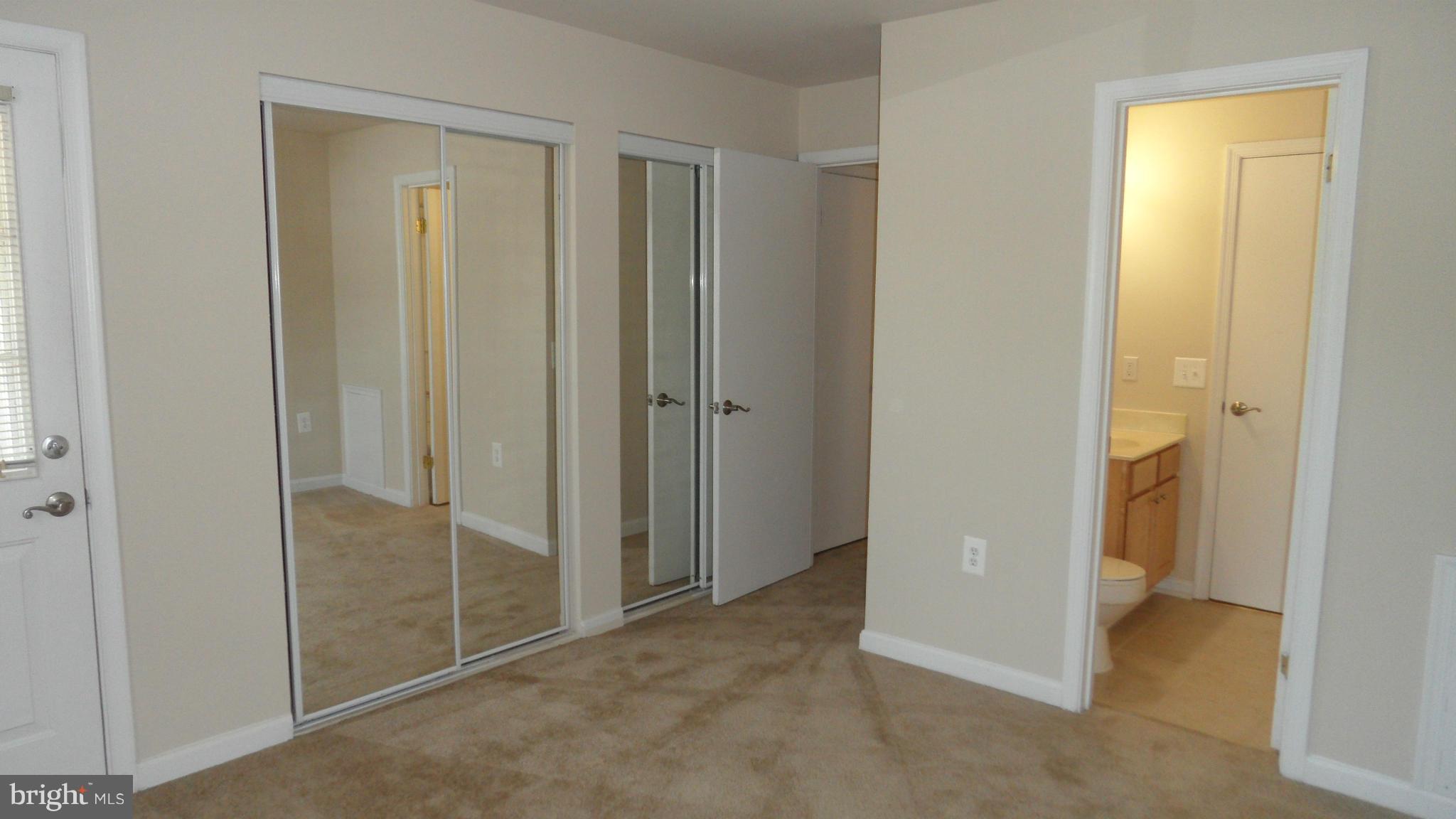 18318 Streamside Drive, Unit 304 Gaithersburg, MD 20879 - Photo 16 of 30 a view of a bathroom with shower