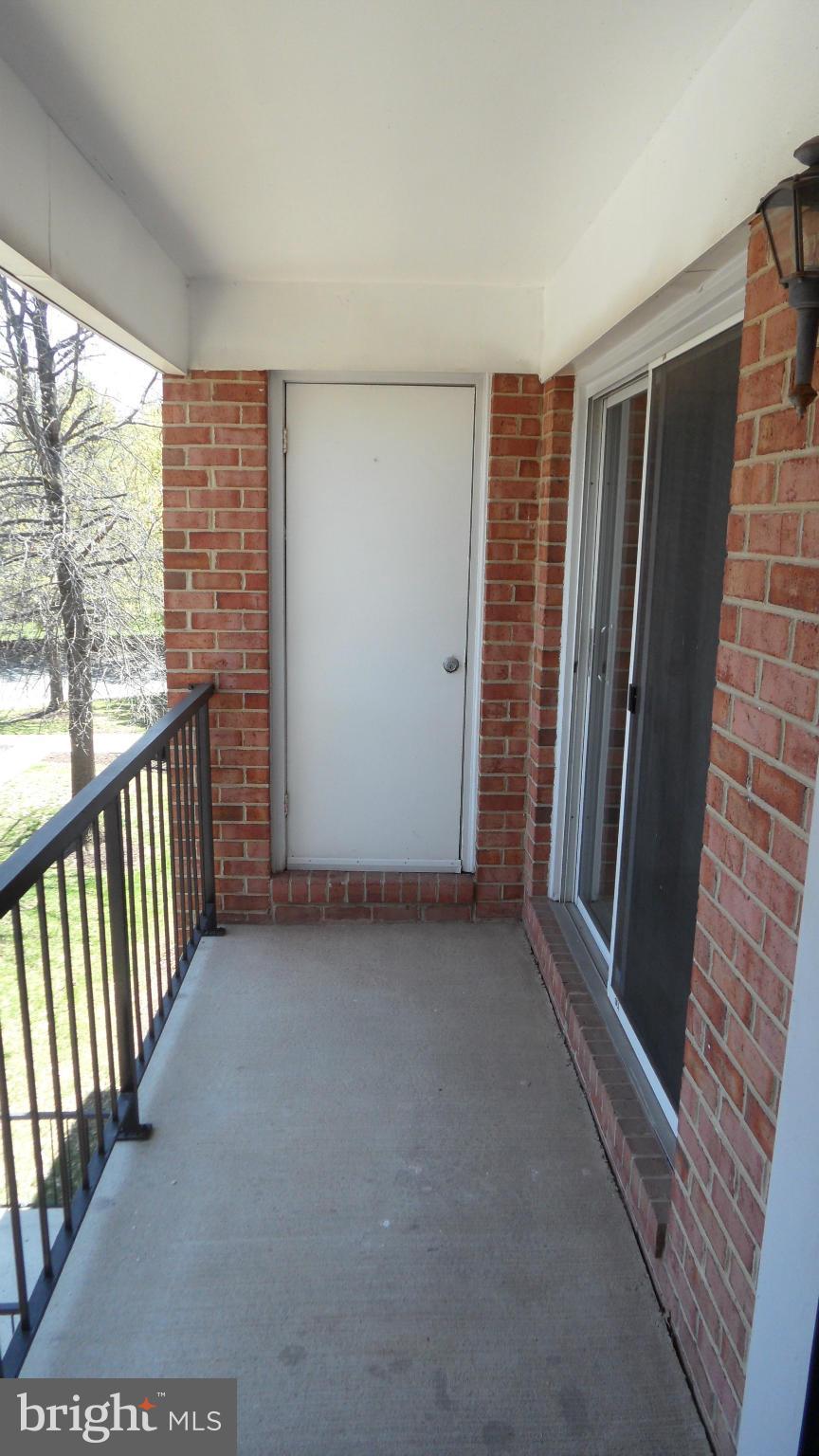18318 Streamside Drive, Unit 304 Gaithersburg, MD 20879 - Photo 19 of 30 a view of empty room with wooden floor and fan