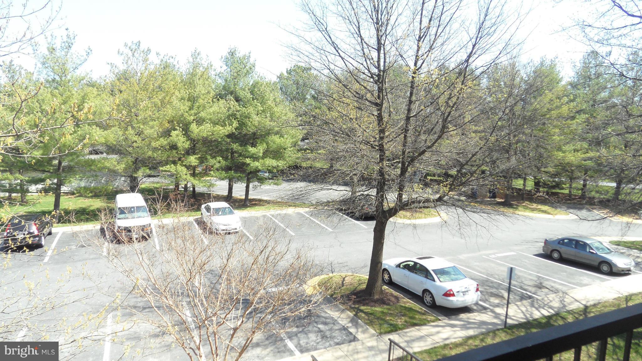 18318 Streamside Drive, Unit 304 Gaithersburg, MD 20879 - Photo 20 of 30 a view of a backyard with sitting area