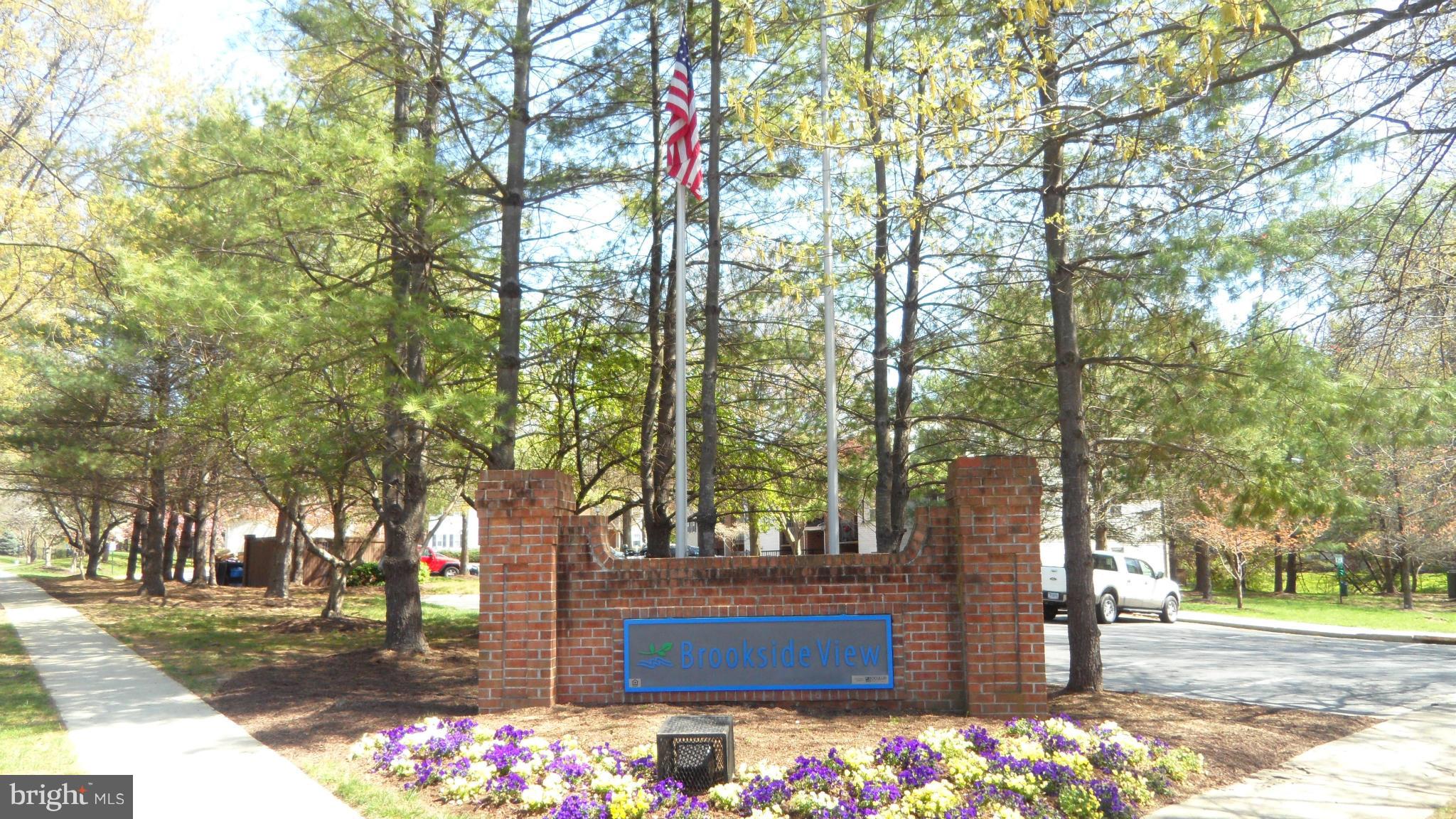 18318 Streamside Drive, Unit 304 Gaithersburg, MD 20879 - Photo 22 of 30 a street view with large trees
