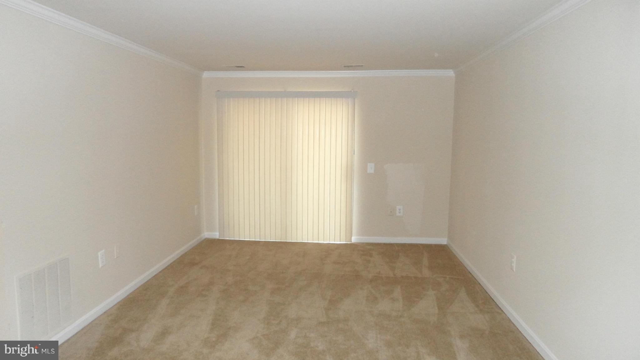 18318 Streamside Drive, Unit 304 Gaithersburg, MD 20879 - Photo 5 of 30 a view of an empty room