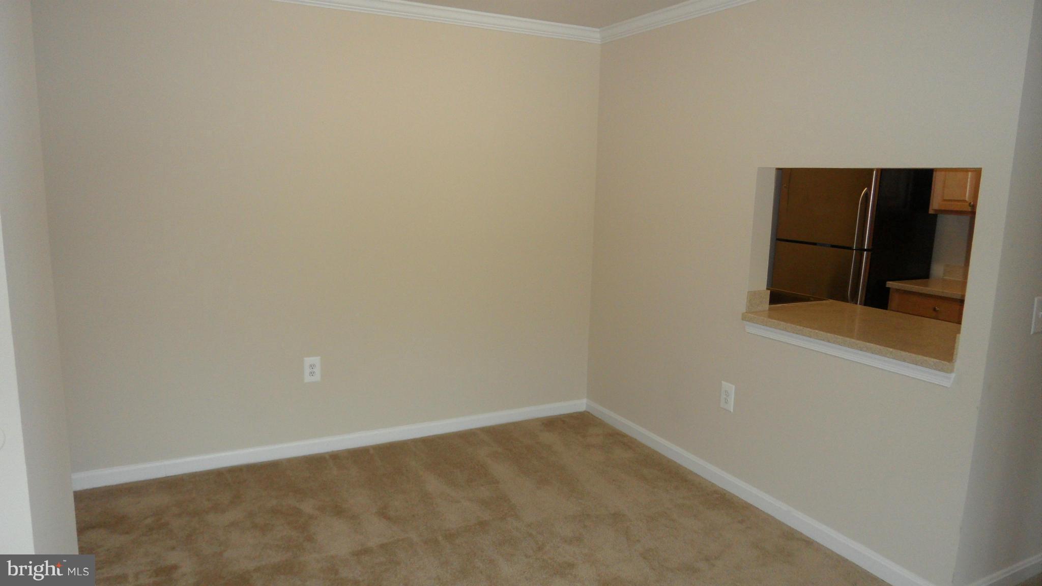 18318 Streamside Drive, Unit 304 Gaithersburg, MD 20879 - Photo 6 of 30 a view of an empty room