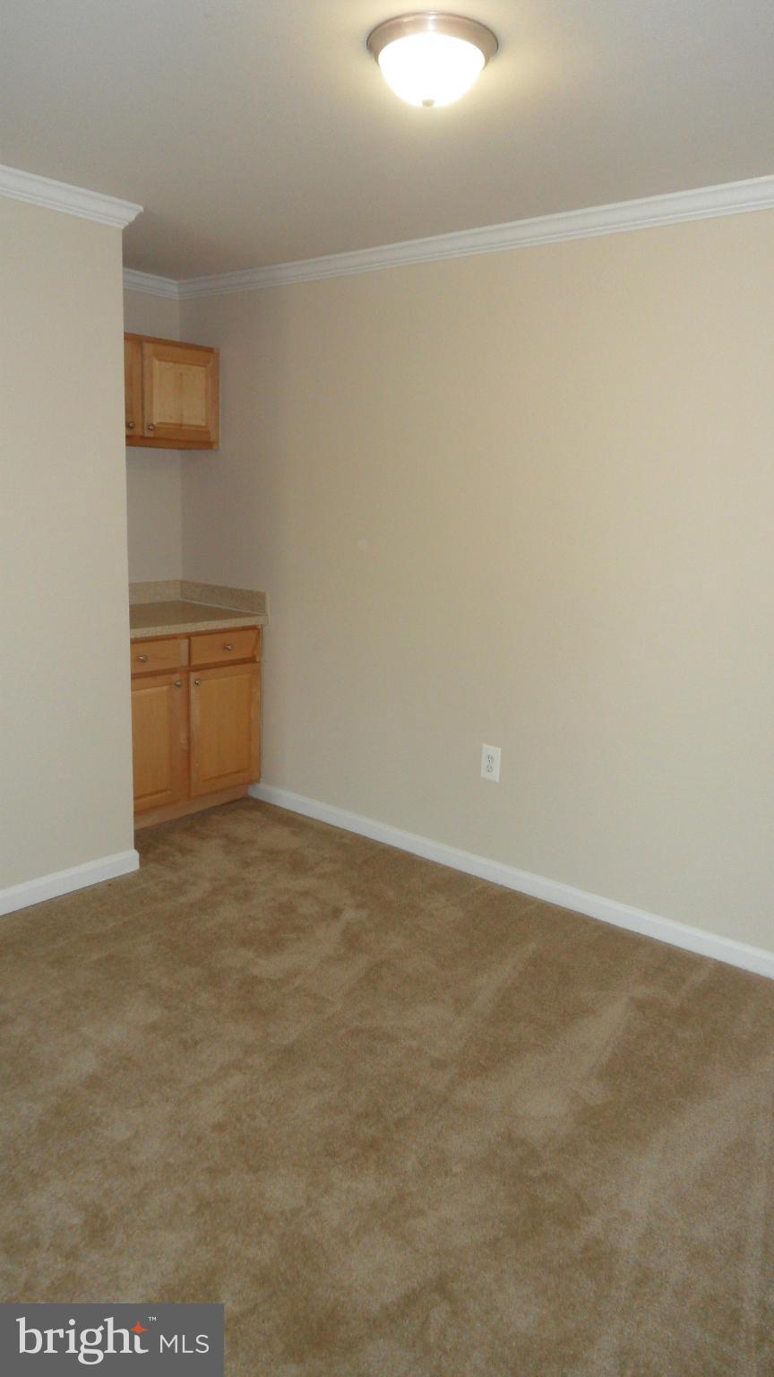 18318 Streamside Drive, Unit 304 Gaithersburg, MD 20879 - Photo 7 of 30 a view of an empty room