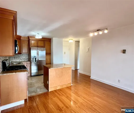 a view of a kitchen cabinets and a stove top oven