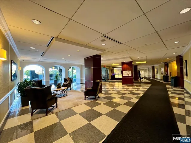 a living room with lots of furniture and a rug