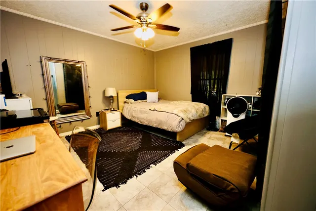 a bedroom with bed and a window