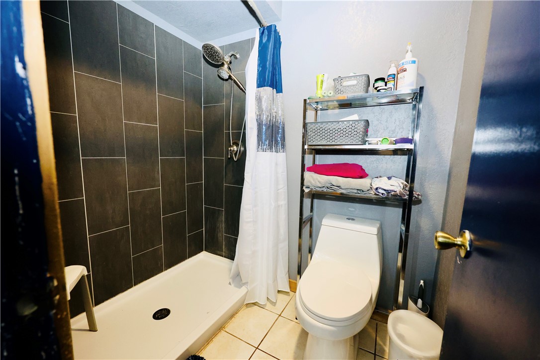 903 McGuill Road Goliad, TX 77963 - Photo 8 of 17 a bathroom with a sink toilet and shower