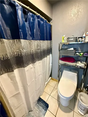 a bathroom with a toilet and a sink