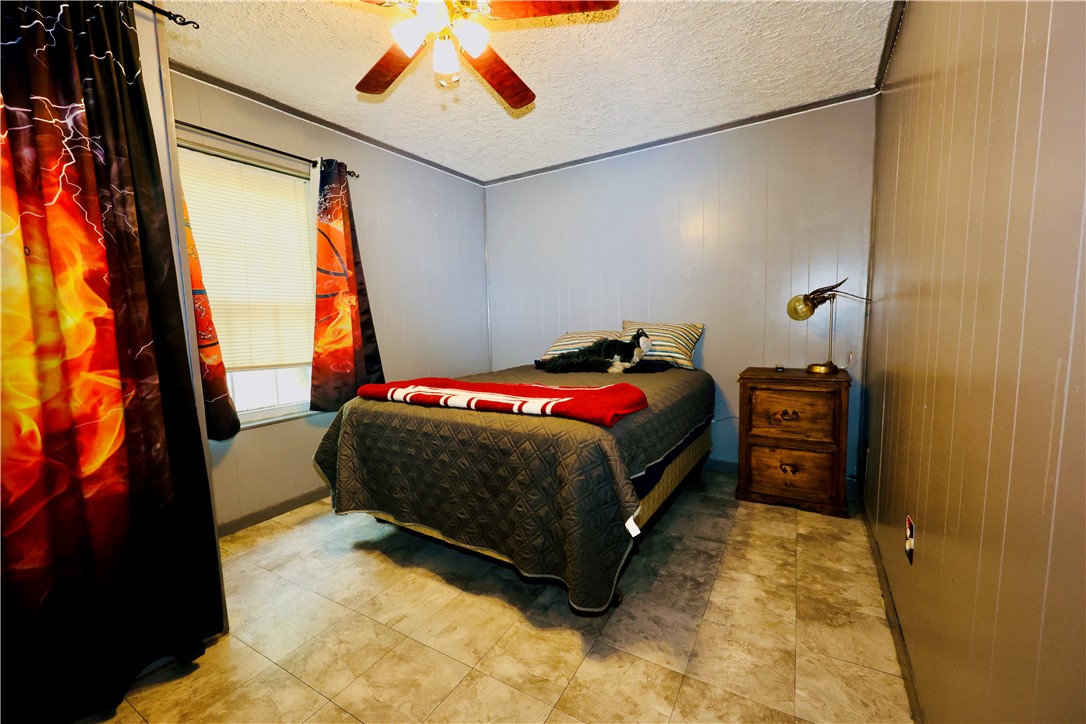 903 McGuill Road Goliad, TX 77963 - Photo 10 of 17 a bedroom with a bed and a window