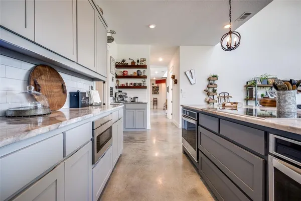 a kitchen with cabinets and window