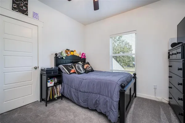 a bedroom with a bed and a closet
