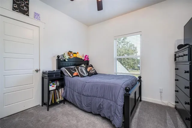 a bedroom with a bed and a closet