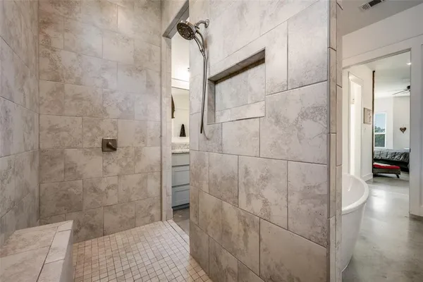 a bathroom with a shower and a sink