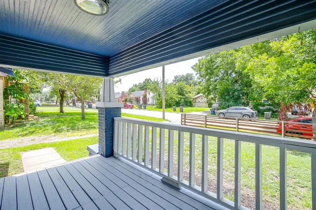 a view of a swimming pool with a porch