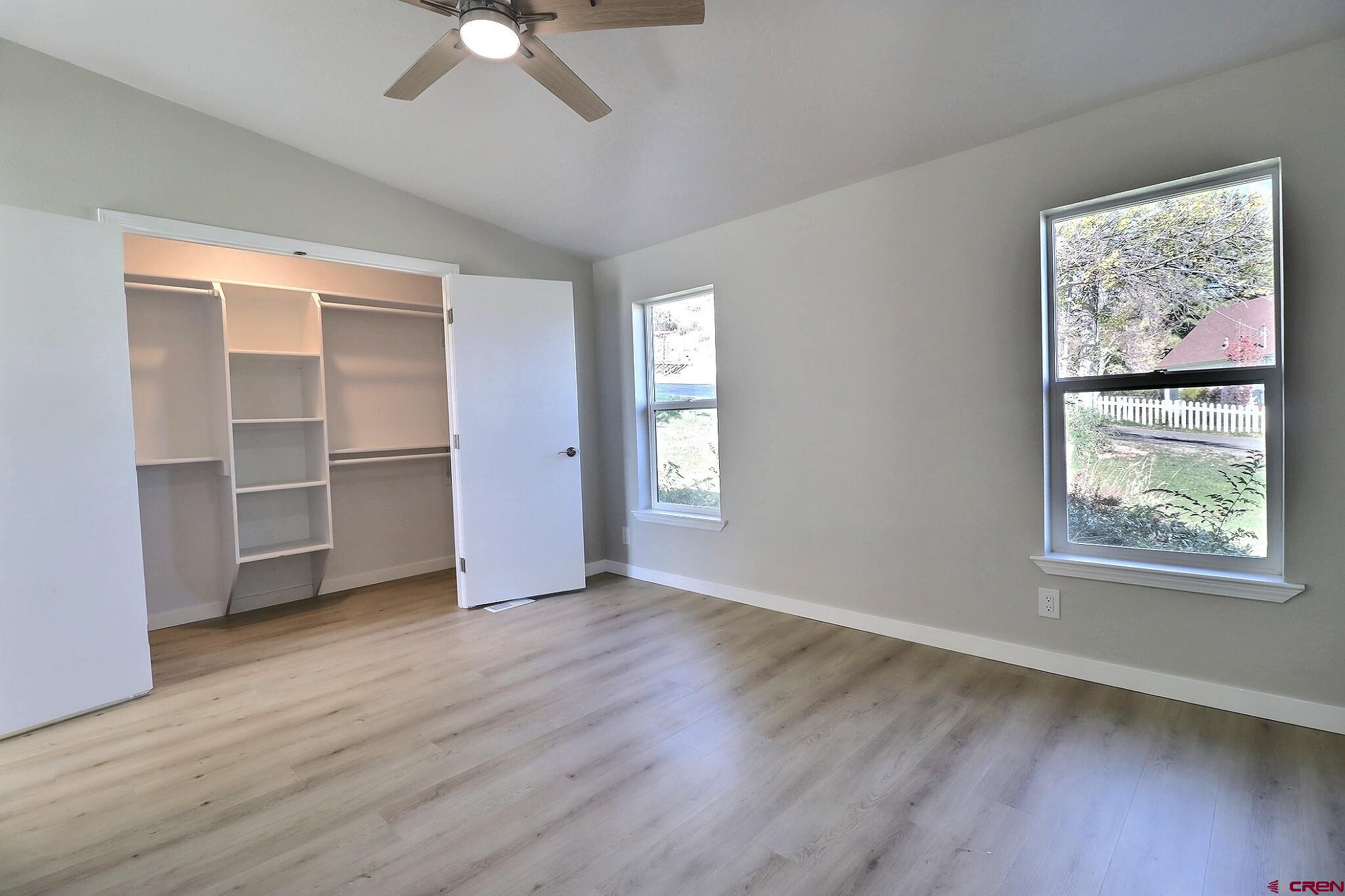 761 Stahl Road Paonia, CO 81428 - Photo 12 of 39 a view of an empty room with a window and wooden floor