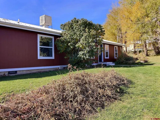 a house with garden in front of it