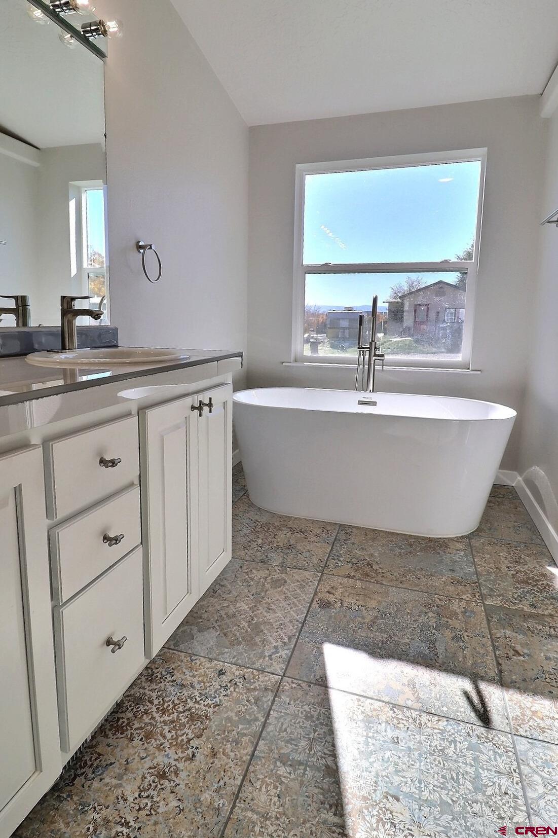 761 Stahl Road Paonia, CO 81428 - Photo 21 of 39 a bathroom with a bathtub and a sink