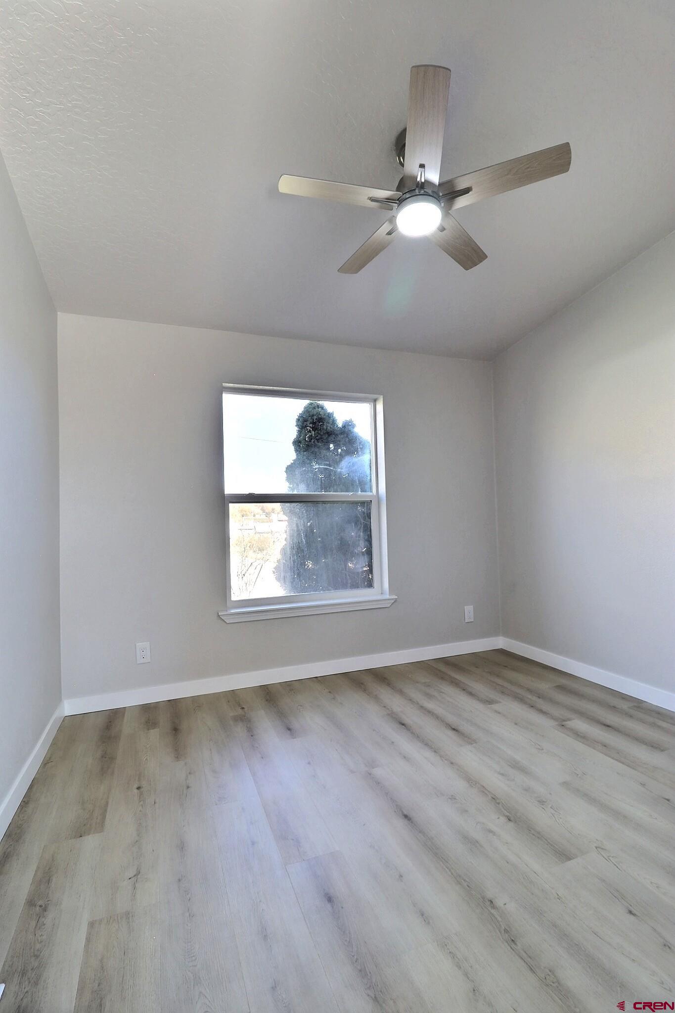 761 Stahl Road Paonia, CO 81428 - Photo 29 of 39 wooden floor in an empty room with a window