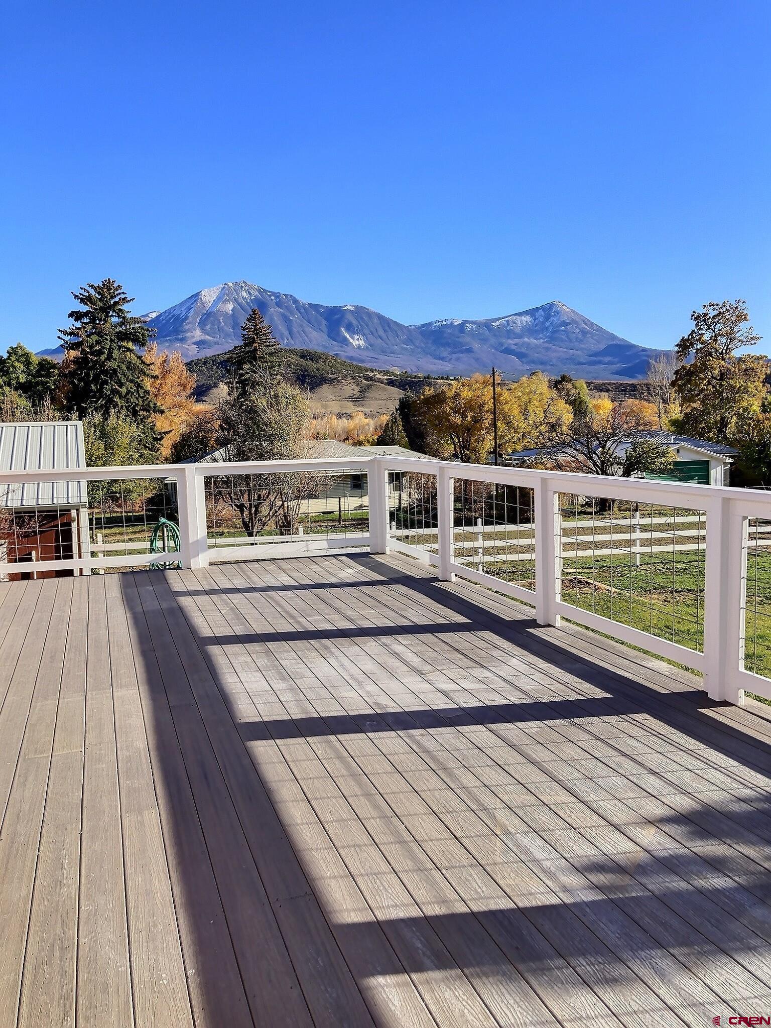 761 Stahl Road Paonia, CO 81428 - Photo 31 of 39 a view of a balcony with wooden floor and city view