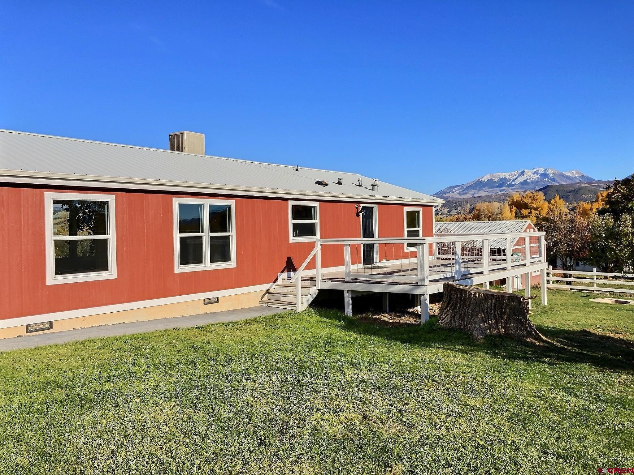 761 Stahl Road Paonia, CO 81428 - Photo 33 of 39 a front view of a house with a garden and porch