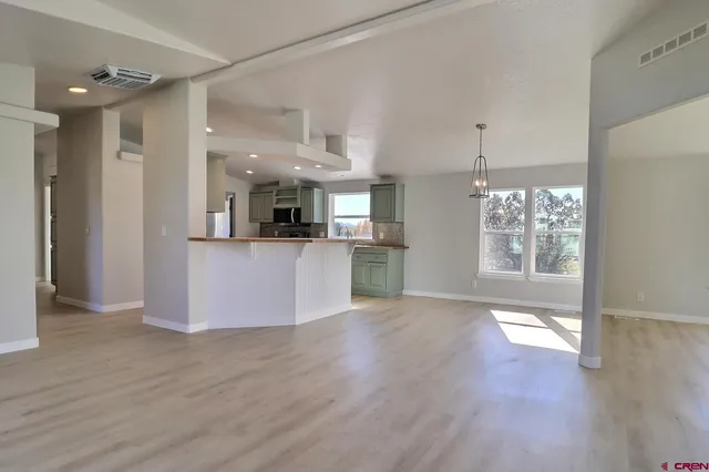 a view of a kitchen cabinets and wooden floor