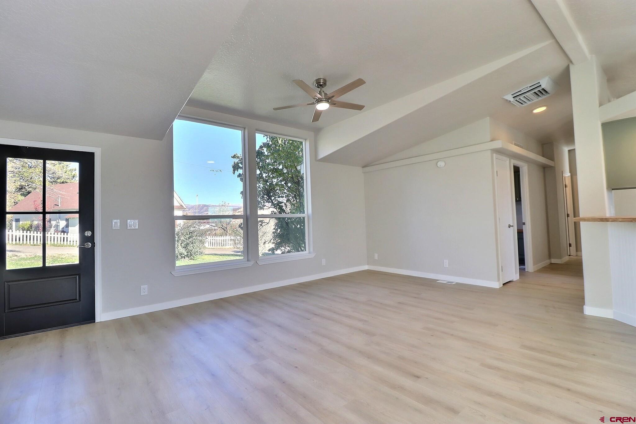 761 Stahl Road Paonia, CO 81428 - Photo 10 of 39 a view of an empty room with a window and wooden floor