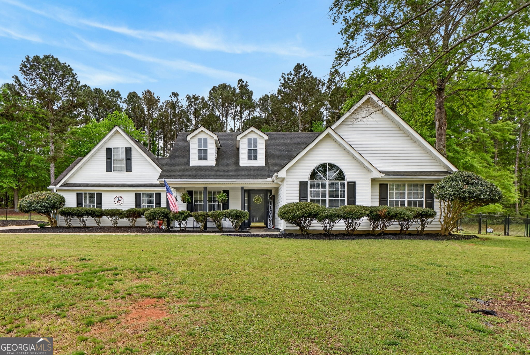a front view of a house with a yard