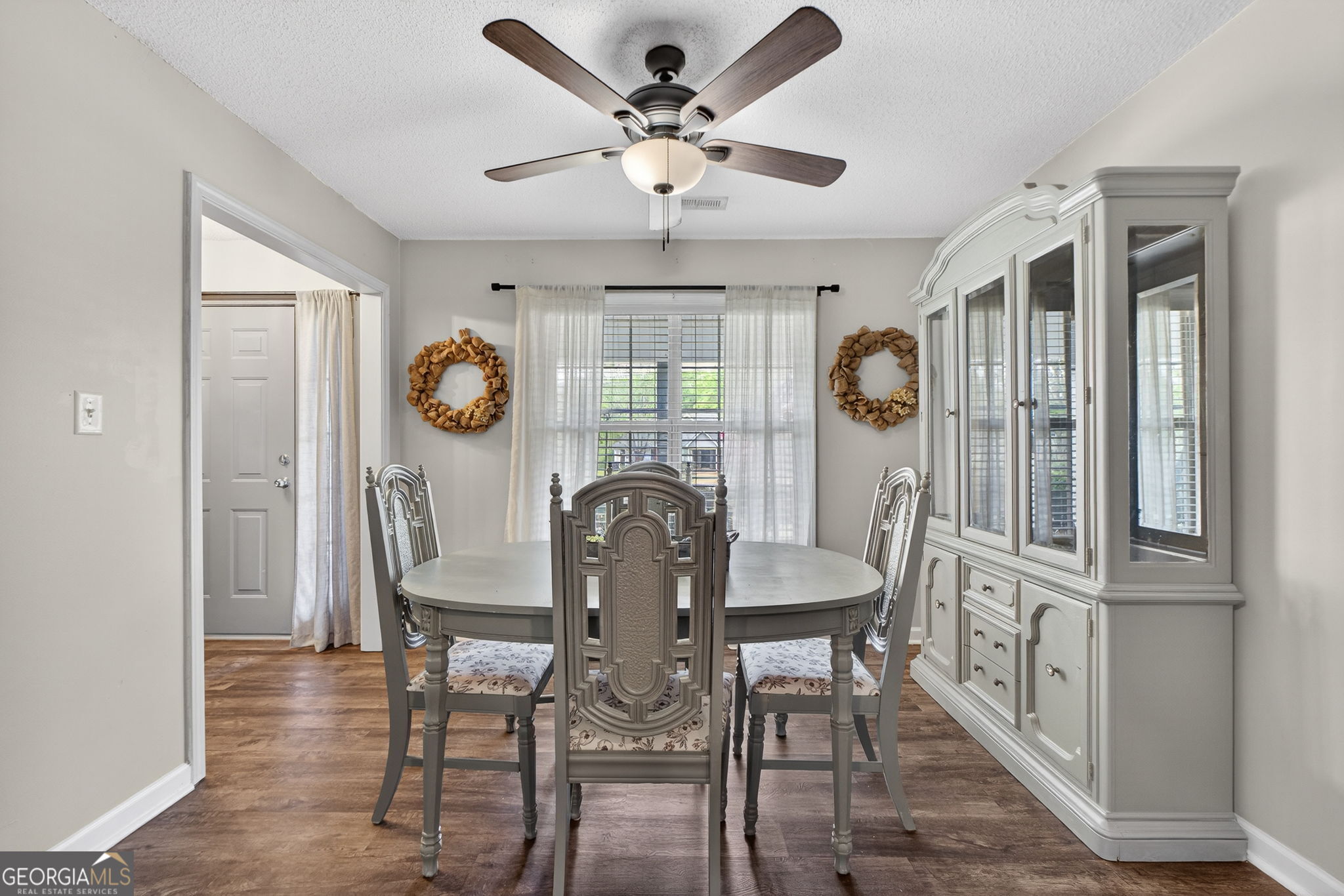 417 Stuarts Lane Locust Grove, GA 30248 - Photo 12 of 48 a view of a dining room with furniture window and wooden floor