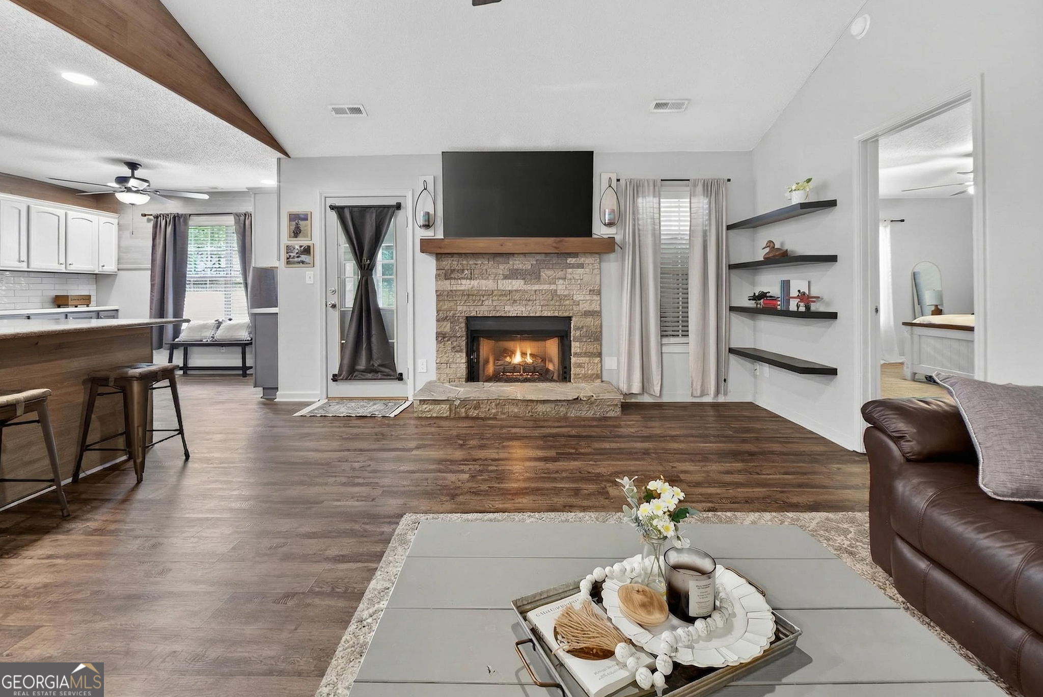 417 Stuarts Lane Locust Grove, GA 30248 - Photo 14 of 48 a living room with furniture and a fireplace