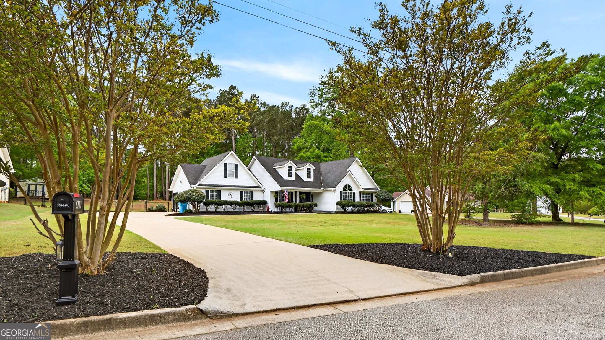 417 Stuarts Lane Locust Grove, GA 30248 - Photo 2 of 48 a front view of a house with a yard