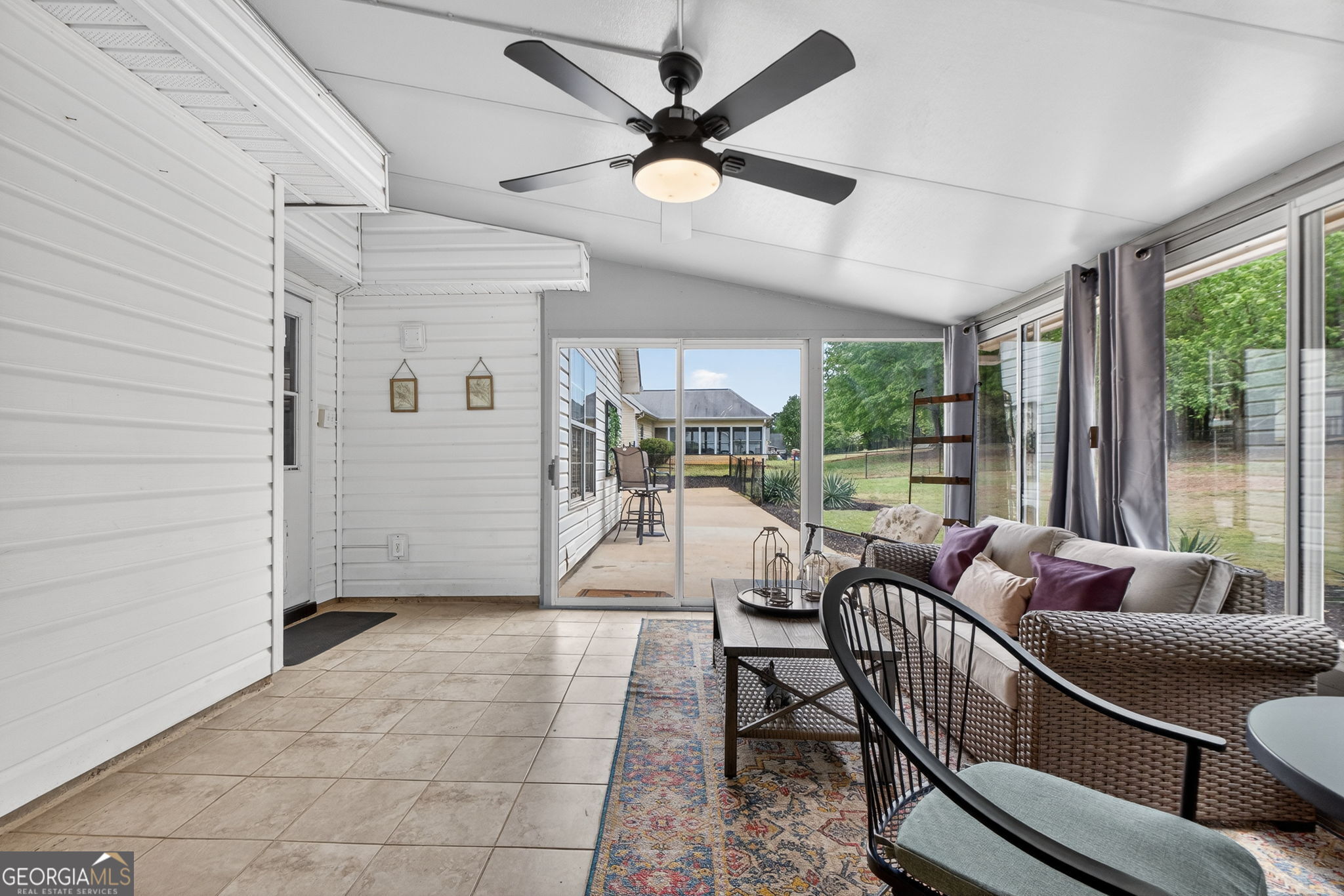 417 Stuarts Lane Locust Grove, GA 30248 - Photo 22 of 48 a living room with furniture and a large window