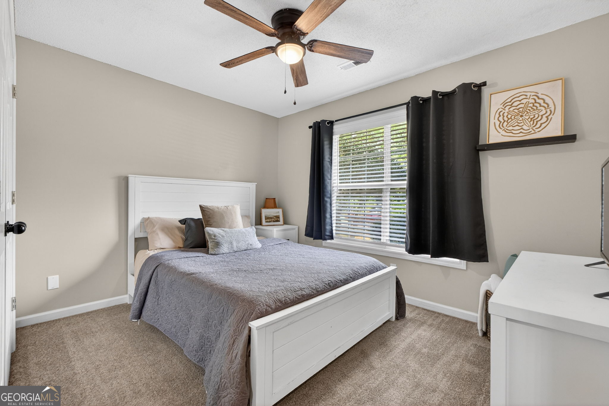 417 Stuarts Lane Locust Grove, GA 30248 - Photo 25 of 48 a bedroom with a bed and a window