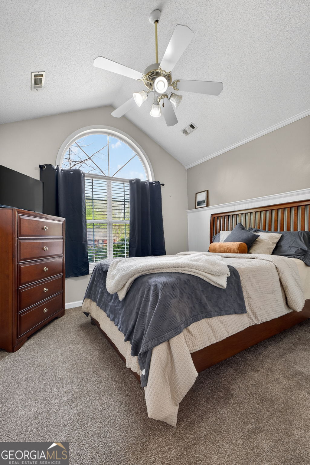 417 Stuarts Lane Locust Grove, GA 30248 - Photo 30 of 48 a spacious bedroom with a bed and a chandelier