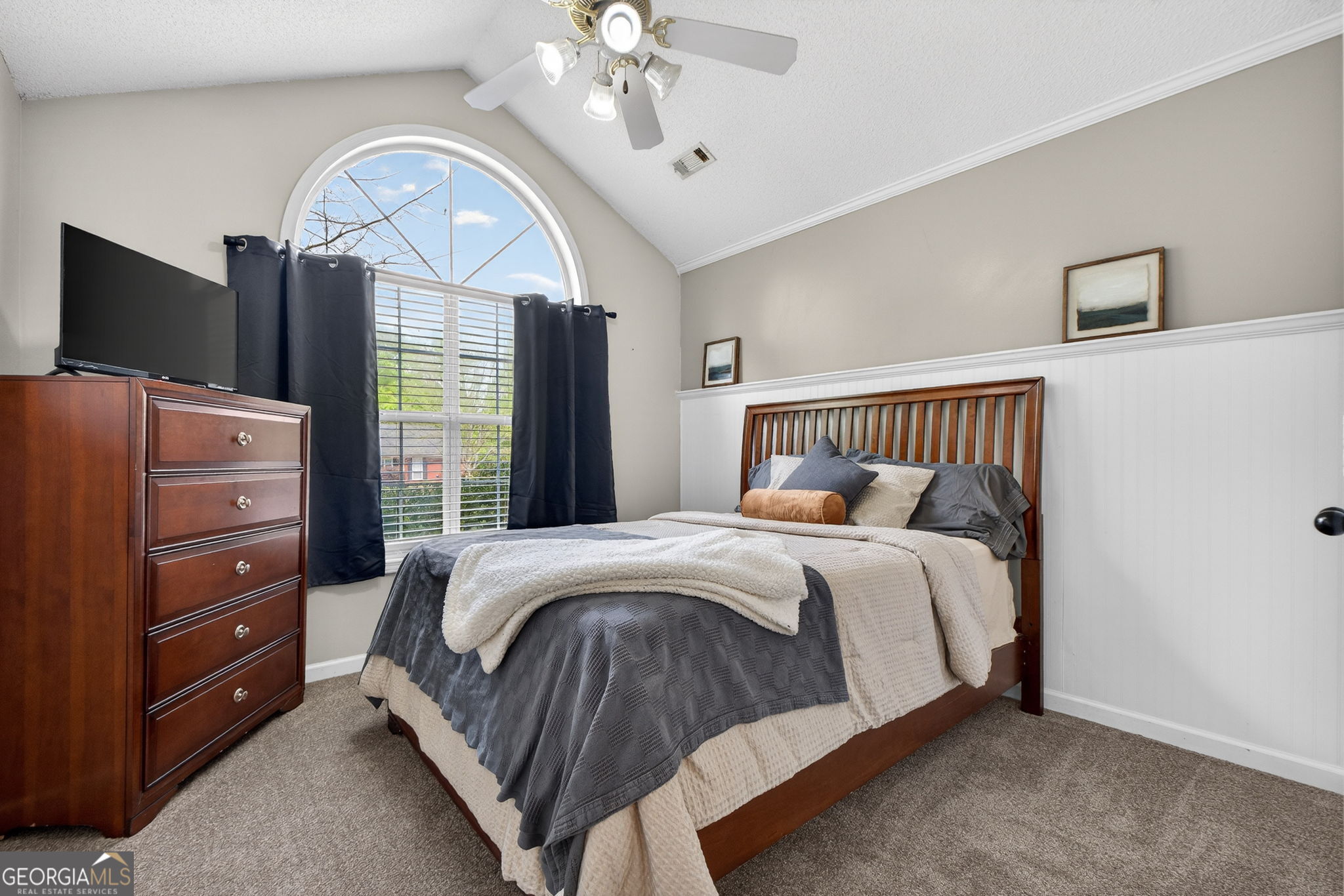 417 Stuarts Lane Locust Grove, GA 30248 - Photo 31 of 48 a bedroom with a large bed and a large window