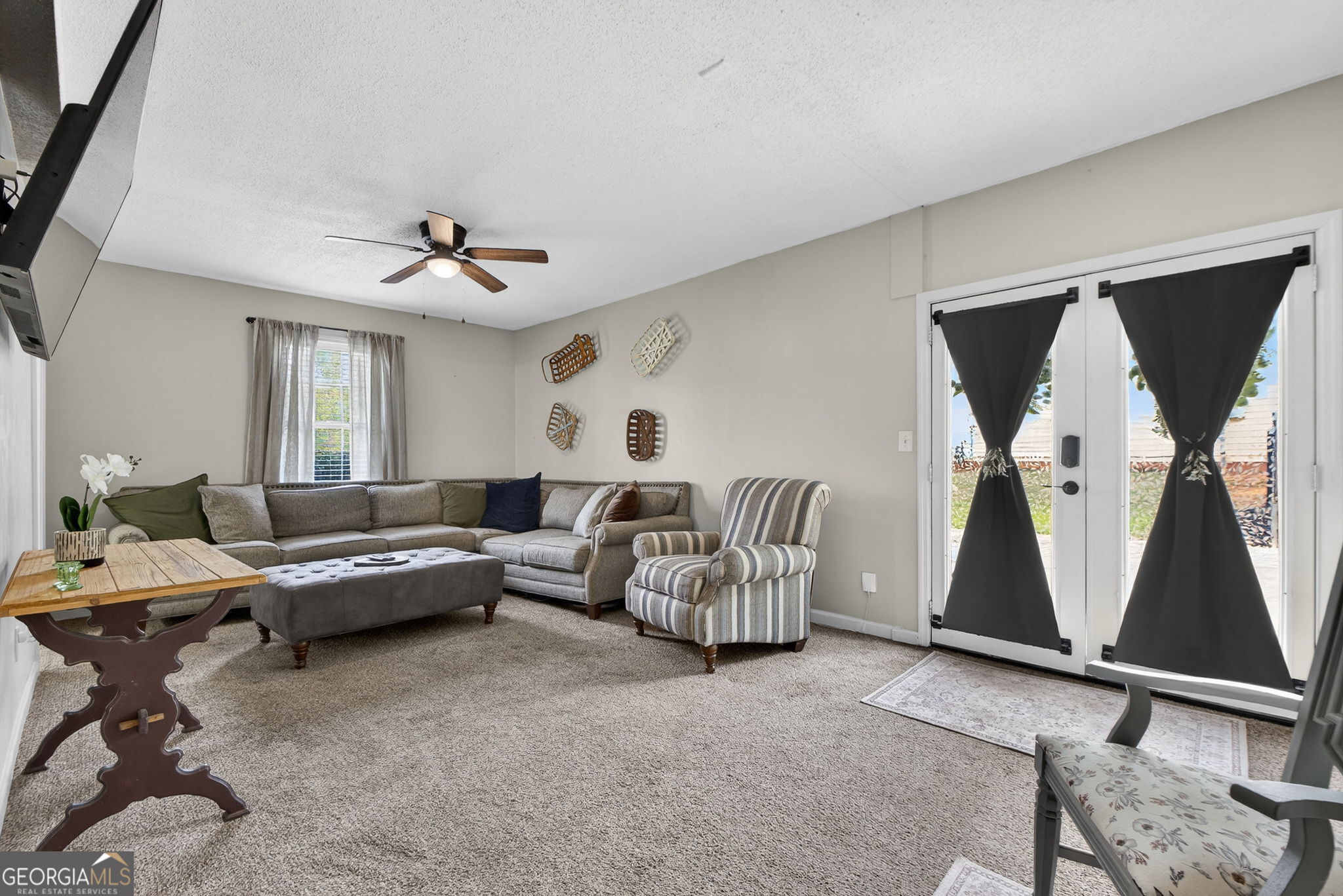 417 Stuarts Lane Locust Grove, GA 30248 - Photo 34 of 48 a living room with furniture and a ceiling fan