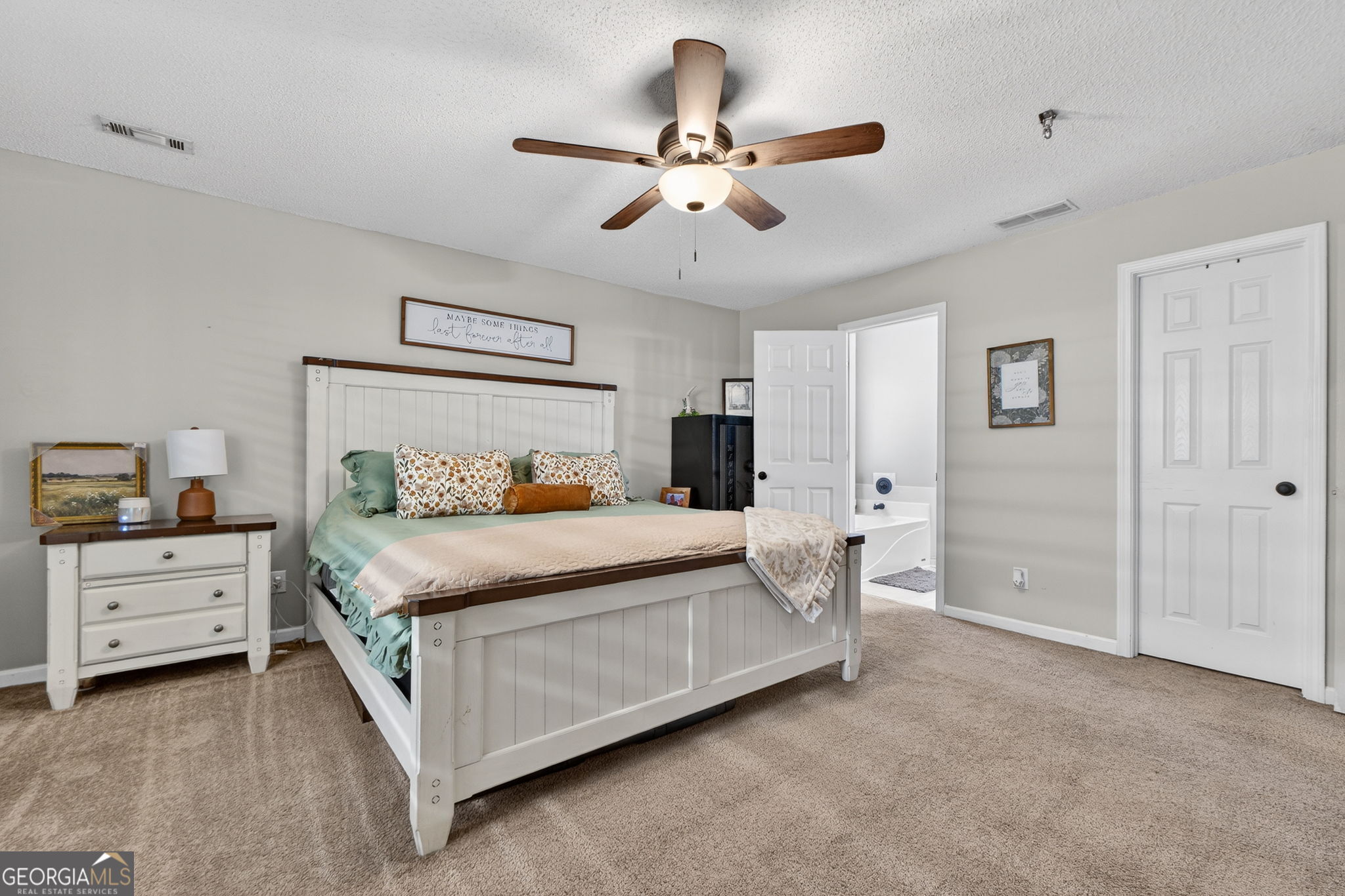 417 Stuarts Lane Locust Grove, GA 30248 - Photo 39 of 48 a bed room with a bed and a ceiling fan