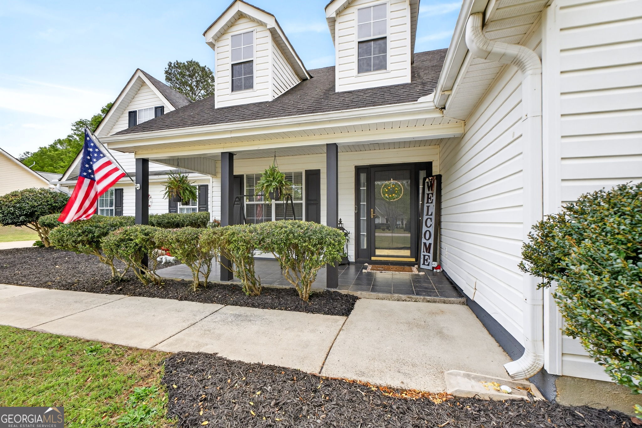 417 Stuarts Lane Locust Grove, GA 30248 - Photo 4 of 48 a view of a house with potted plants