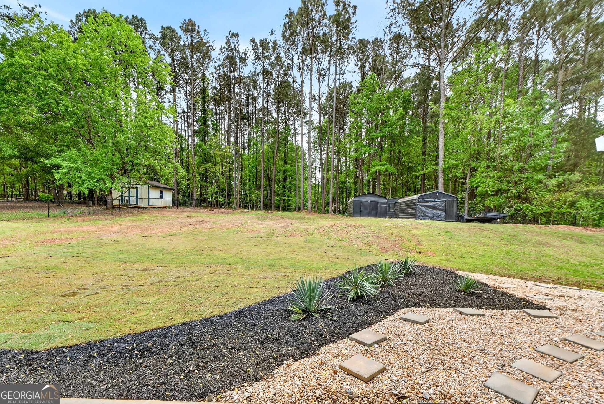 417 Stuarts Lane Locust Grove, GA 30248 - Photo 46 of 48 a view of a swimming pool and a yard