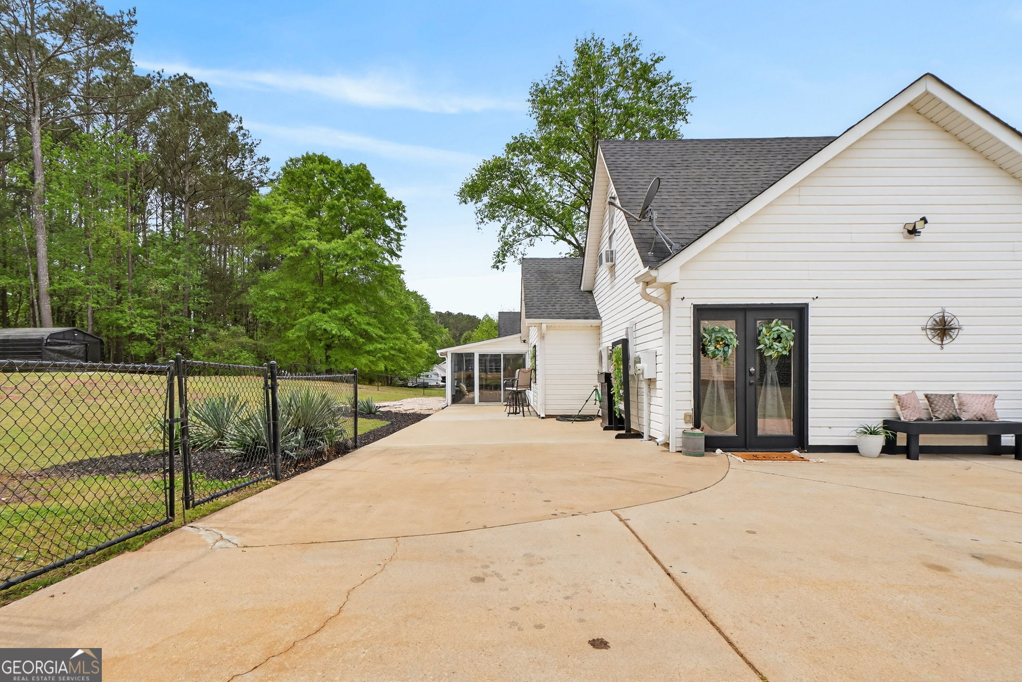 417 Stuarts Lane Locust Grove, GA 30248 - Photo 47 of 48 a view of a house with a small yard and large trees
