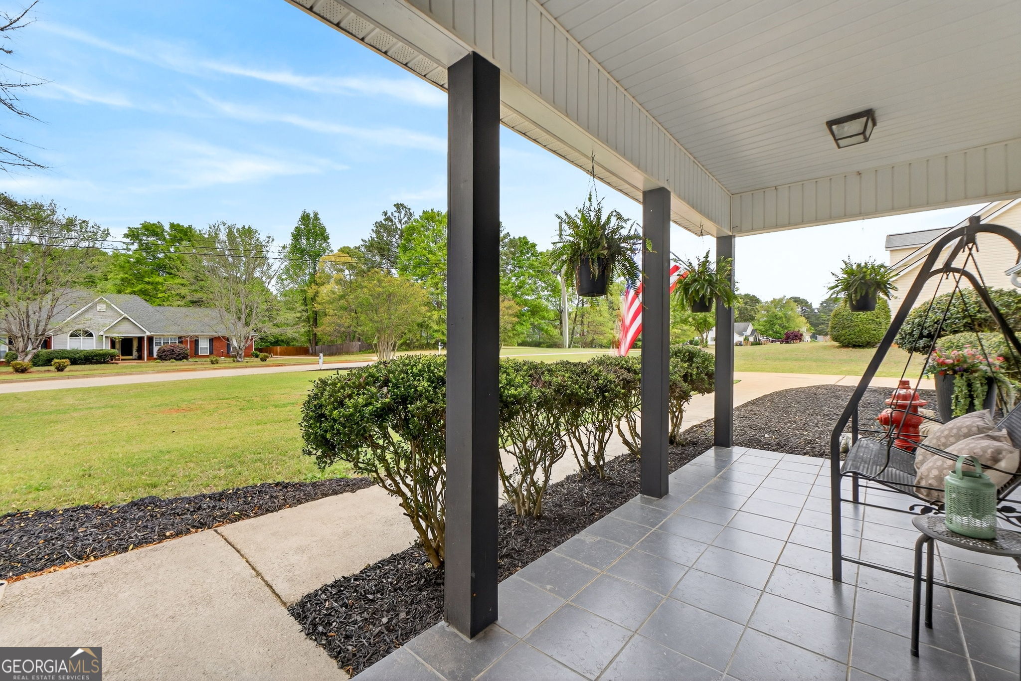 417 Stuarts Lane Locust Grove, GA 30248 - Photo 5 of 48 a view of a porch with furniture and garden